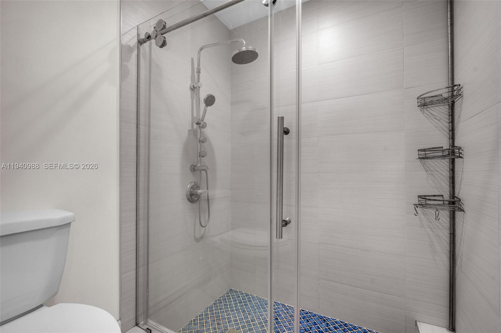 11125 Southwest 134th Court Miami, FL 33186 - Photo 18 of 33 a bathroom with a shower toilet and sink