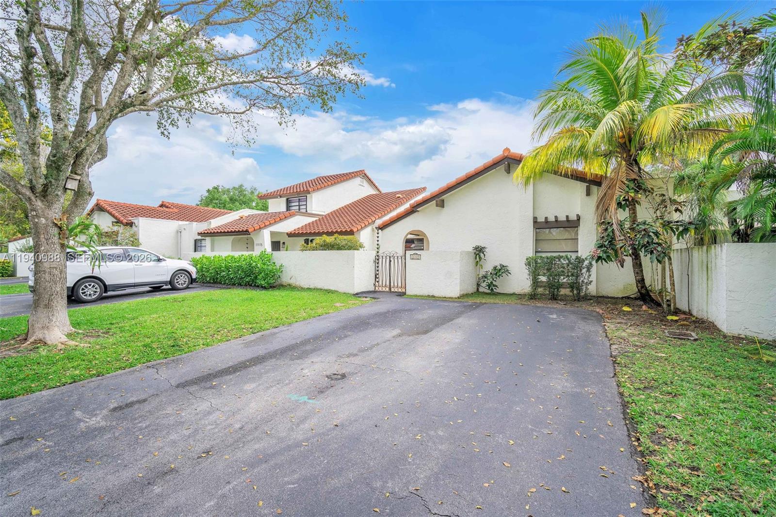 11125 Southwest 134th Court Miami, FL 33186 - Photo 2 of 33 a view of a house with a yard and garage
