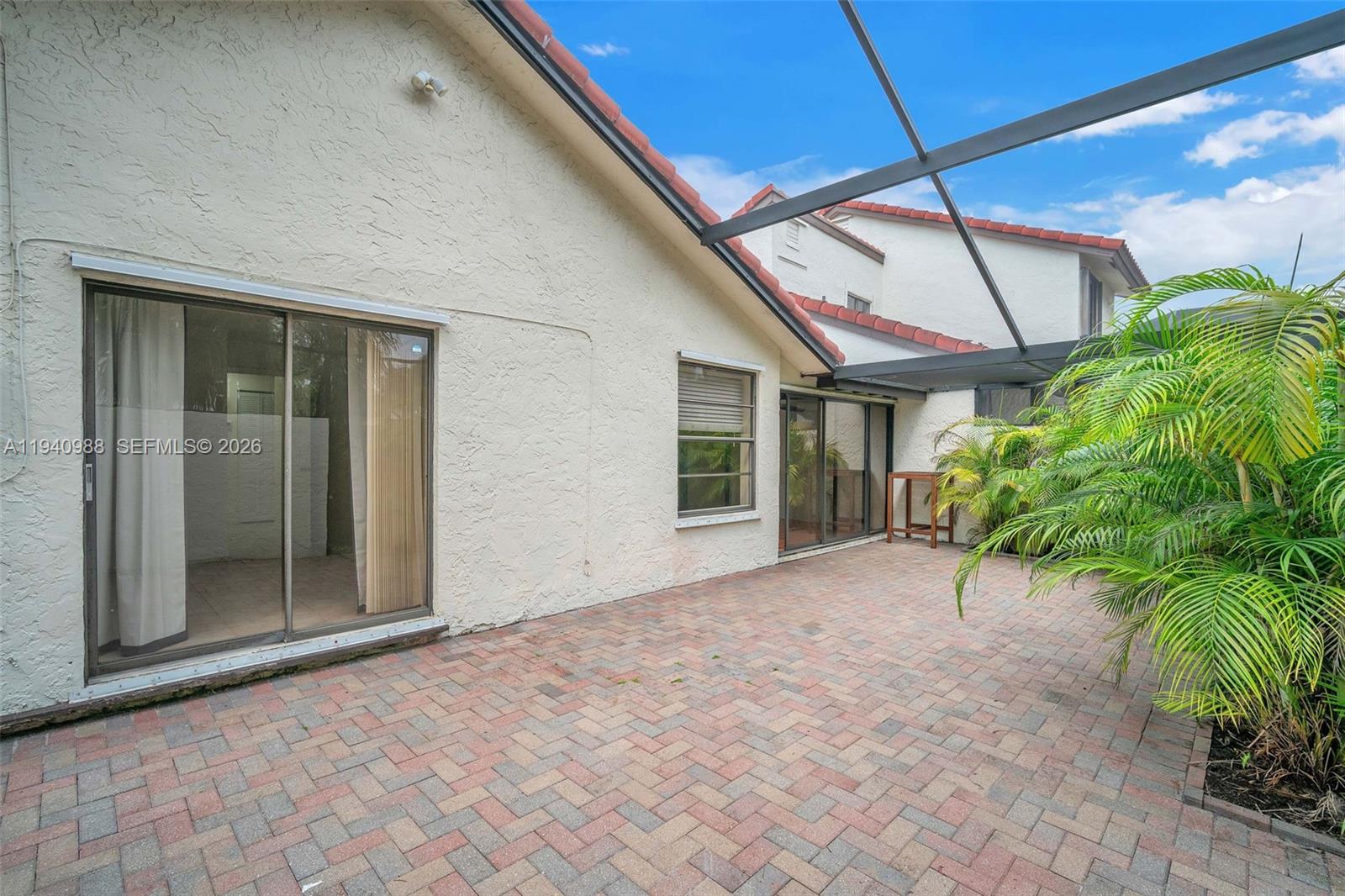 11125 Southwest 134th Court Miami, FL 33186 - Photo 29 of 33 a view of a house with a yard and potted plants