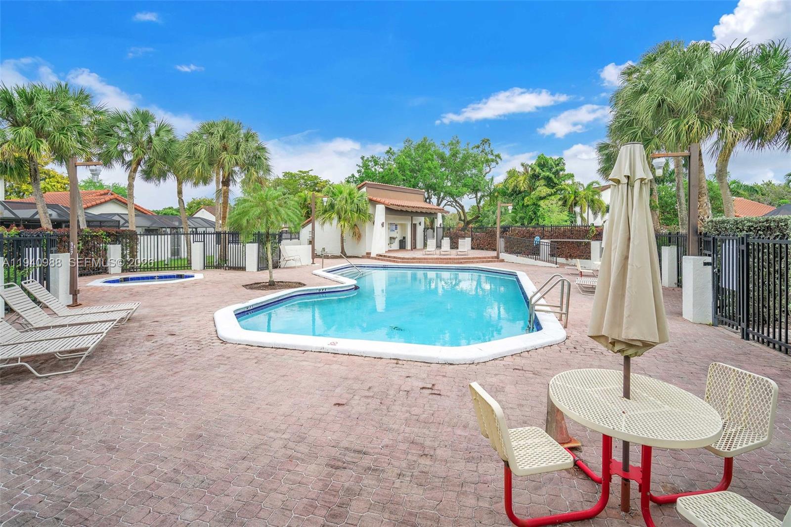 11125 Southwest 134th Court Miami, FL 33186 - Photo 32 of 33 a view of a house with swimming pool and sitting area