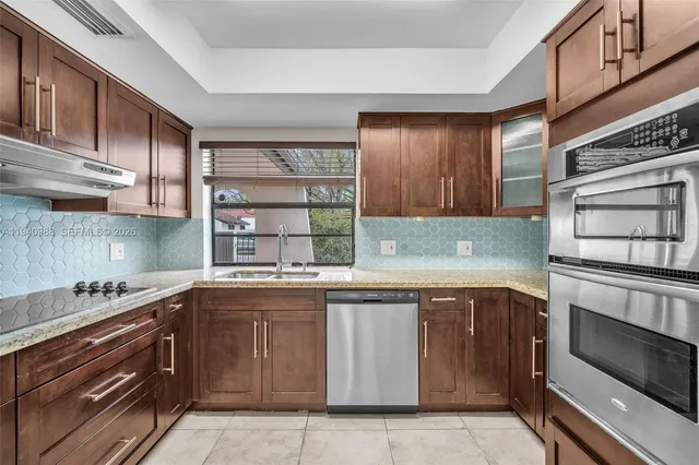 a kitchen with a sink and cabinets