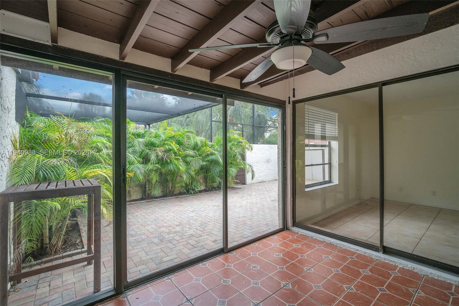 11125 Southwest 134th Court Miami, FL 33186 - Photo 10 of 33 a view of empty room with floor to ceiling windows