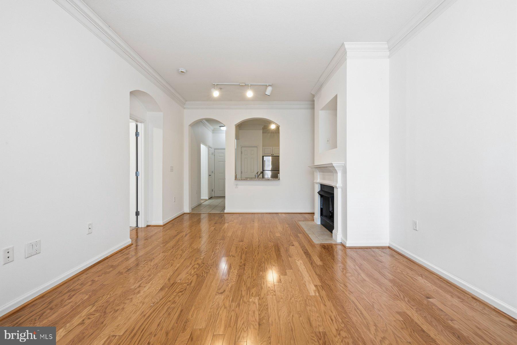 7 Booth Street, Unit 109 Gaithersburg, MD 20878 - Photo 12 of 28 a view of a room with wooden floor and a window