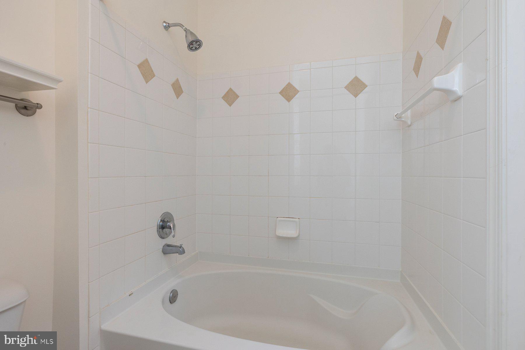 7 Booth Street, Unit 109 Gaithersburg, MD 20878 - Photo 18 of 28 a close up of a bathtub