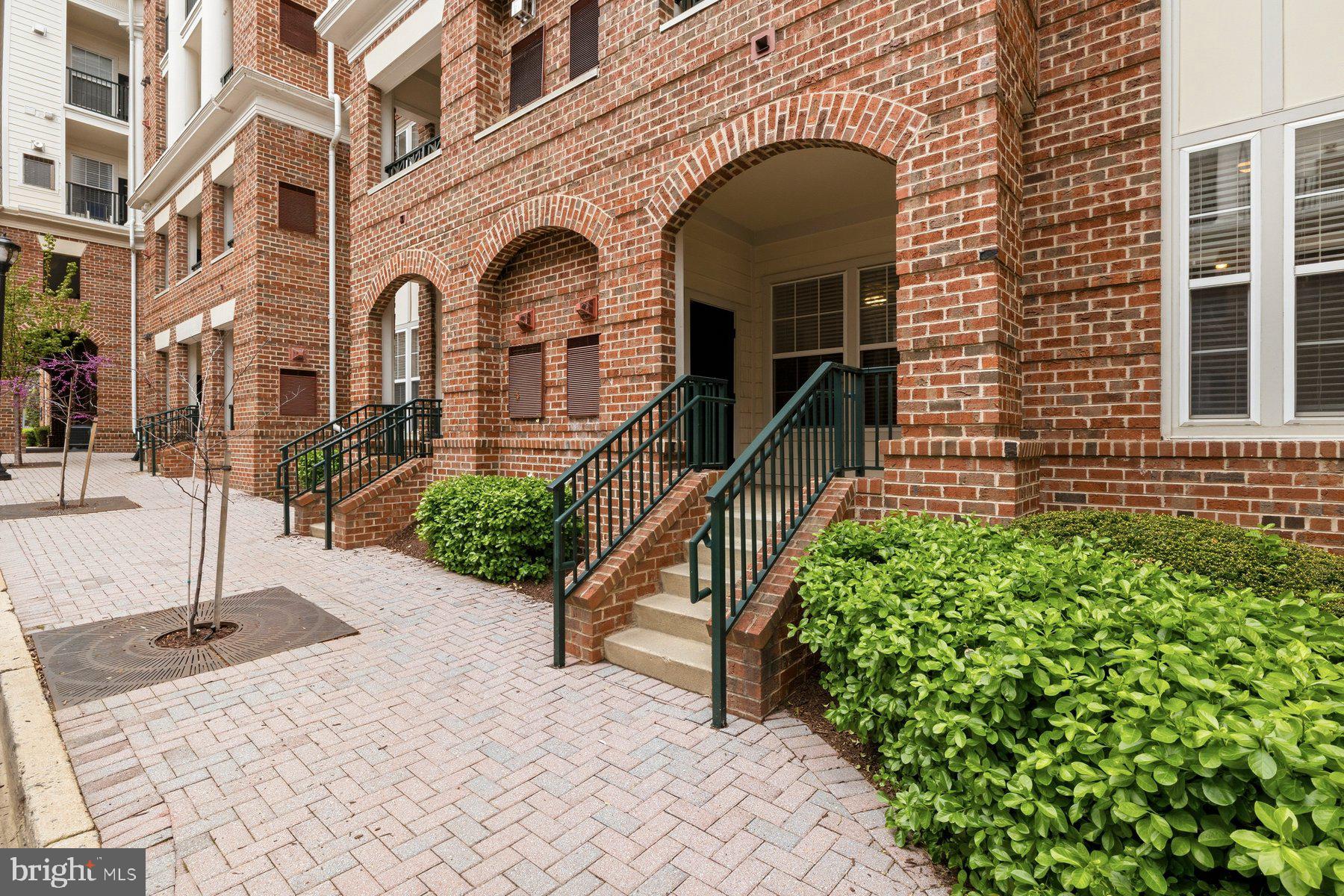 7 Booth Street, Unit 109 Gaithersburg, MD 20878 - Photo 20 of 28 a front view of a house with garden