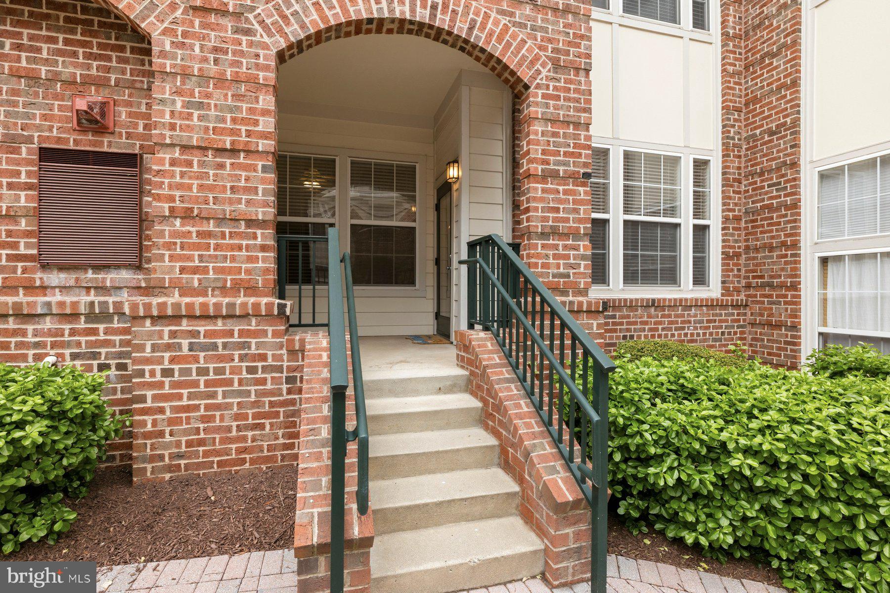 7 Booth Street, Unit 109 Gaithersburg, MD 20878 - Photo 2 of 28 a view of a brick house with a large windows