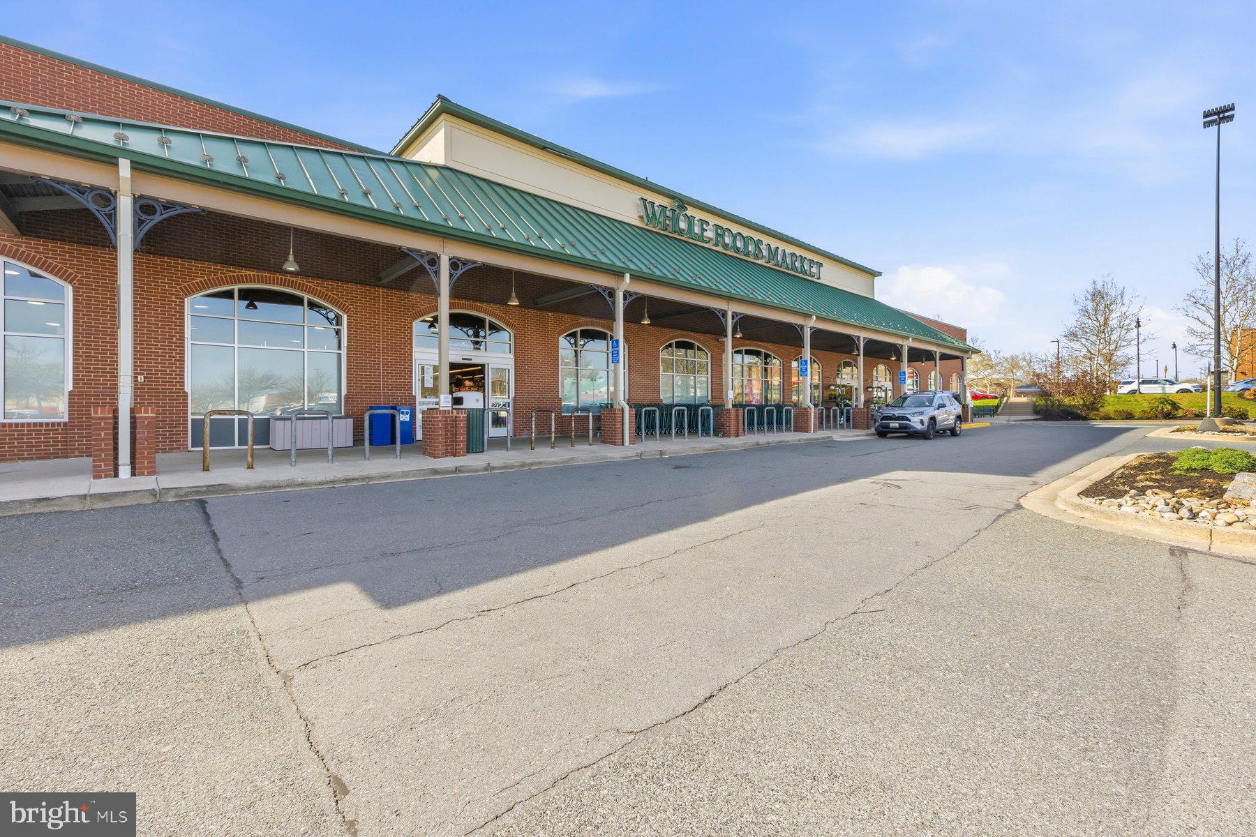 7 Booth Street, Unit 109 Gaithersburg, MD 20878 - Photo 25 of 28 a view of a building with car parked