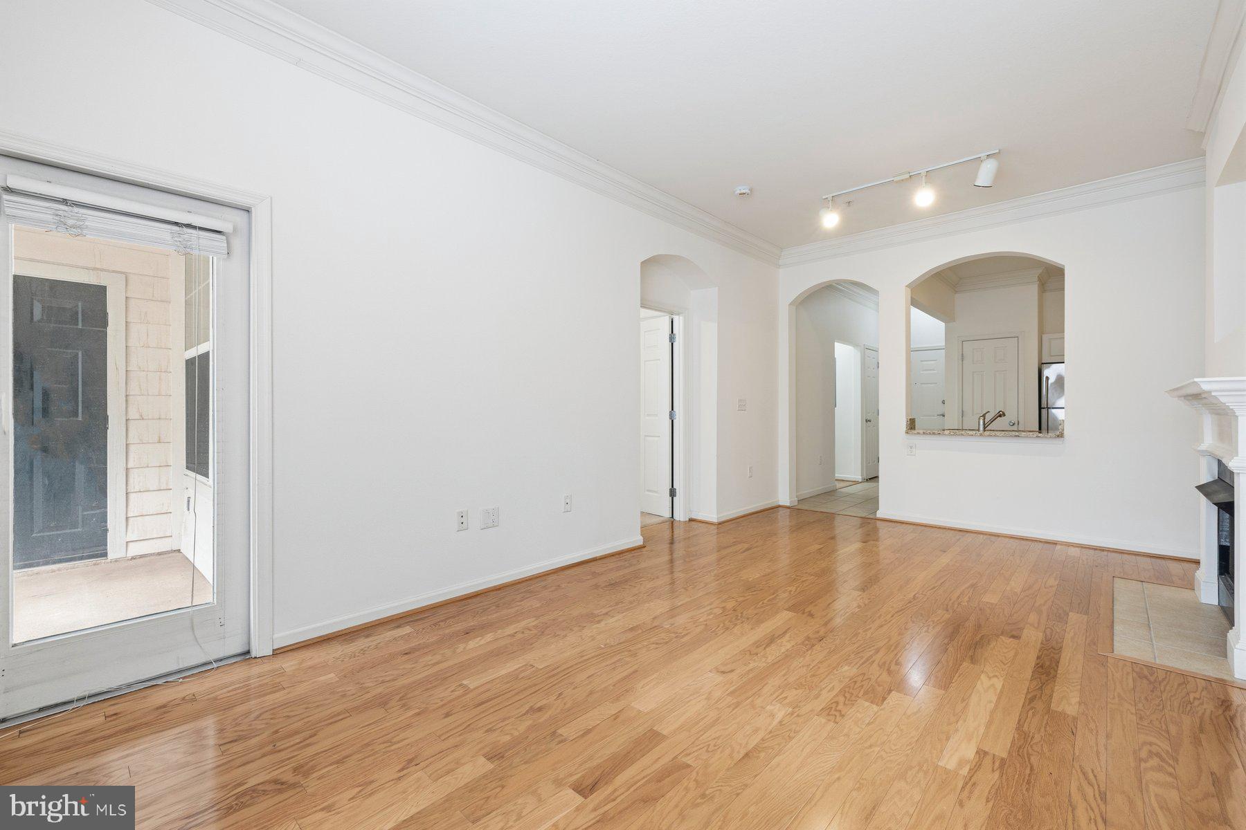 7 Booth Street, Unit 109 Gaithersburg, MD 20878 - Photo 4 of 28 a view of an empty room and glass door