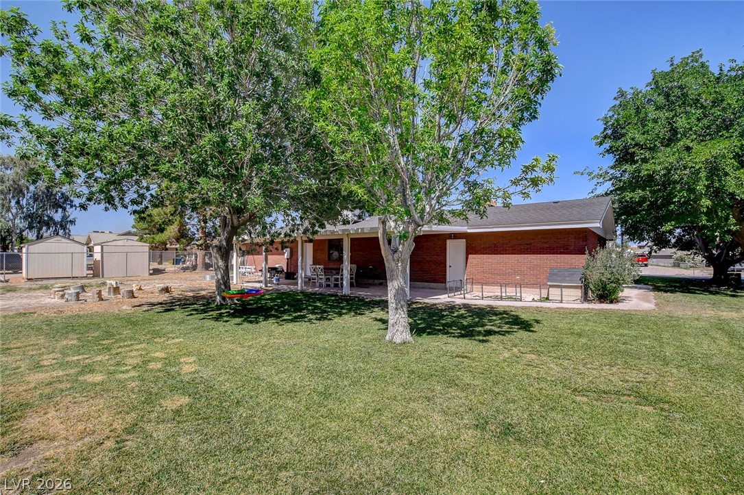 3765 Berkeley Street Logandale, NV 89021 - Photo 69 of 87 This spacious backyard offers ample room for outdoor activities and comfortable outdoor living.