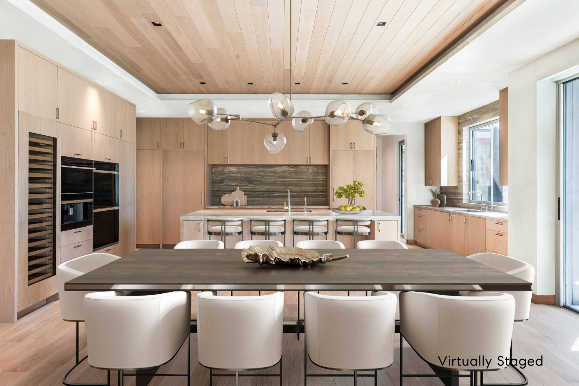 10 Mill Path Bridgehampton, NY 11963 - Photo 14 of 46 a kitchen with a table chairs stove and cabinets