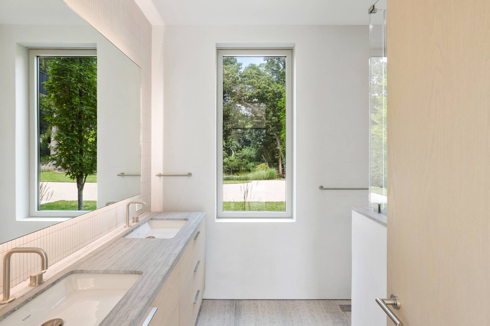 10 Mill Path Bridgehampton, NY 11963 - Photo 22 of 46 a bathroom with a granite countertop sink and a window
