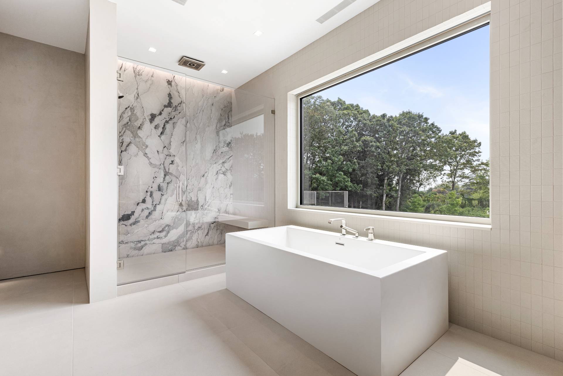 10 Mill Path Bridgehampton, NY 11963 - Photo 25 of 46 a bathroom with a bathtub and shower