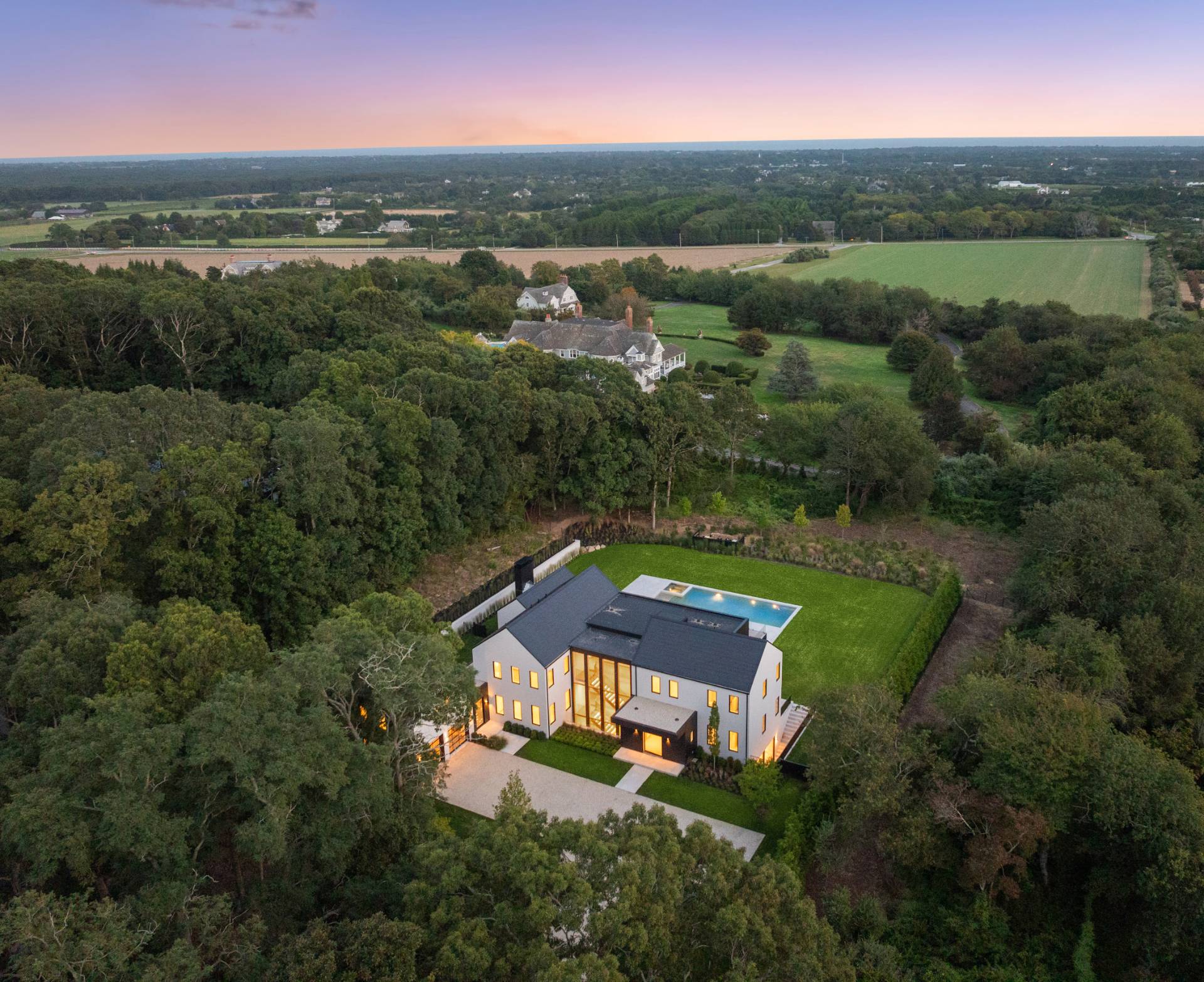 10 Mill Path Bridgehampton, NY 11963 - Photo 3 of 46 an aerial view of a house with a garden and trees
