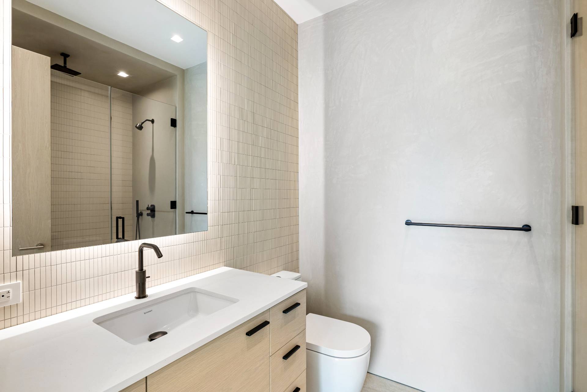 10 Mill Path Bridgehampton, NY 11963 - Photo 32 of 46 a bathroom with a sink a toilet and a mirror