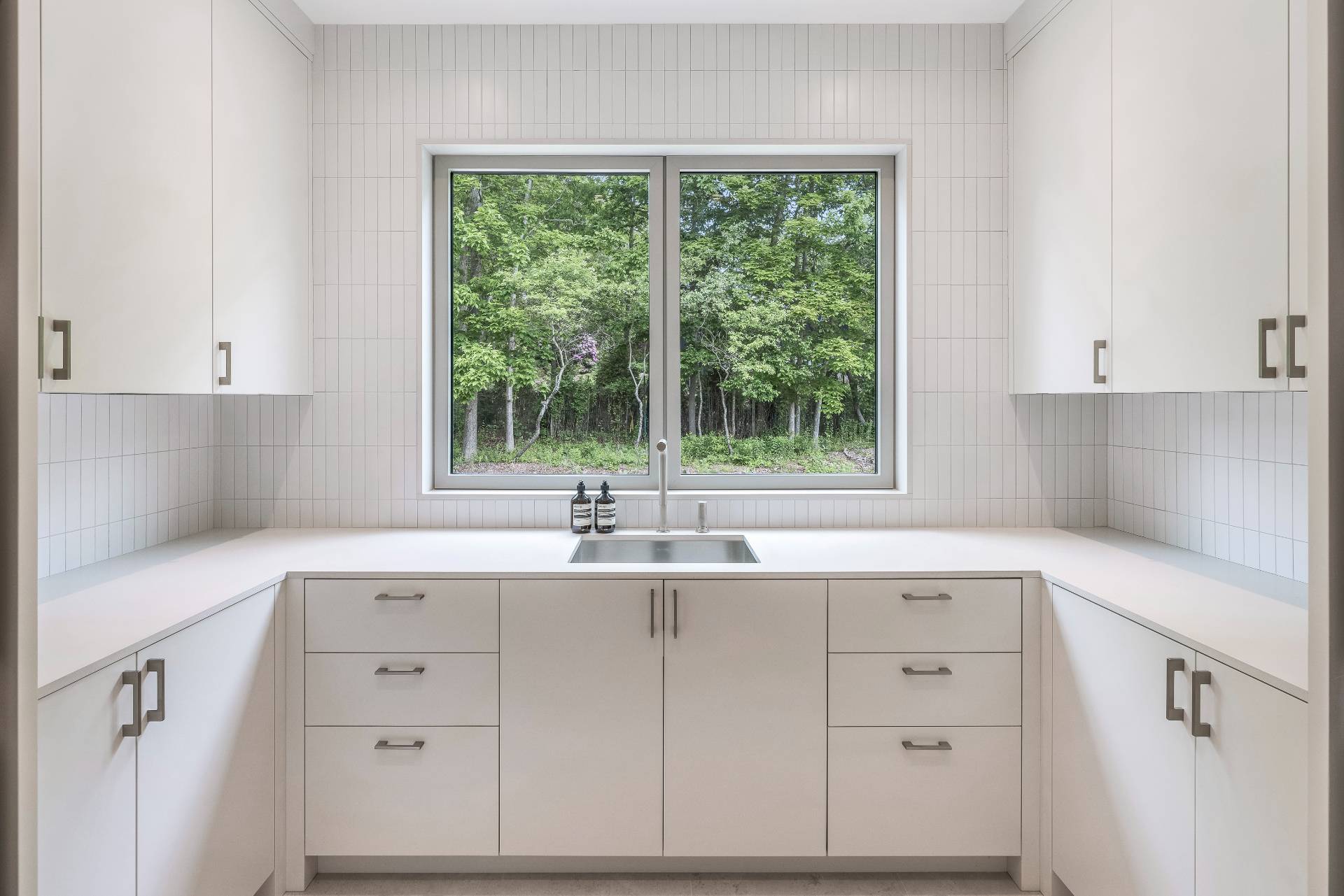 10 Mill Path Bridgehampton, NY 11963 - Photo 35 of 46 a kitchen with a sink window and cabinets
