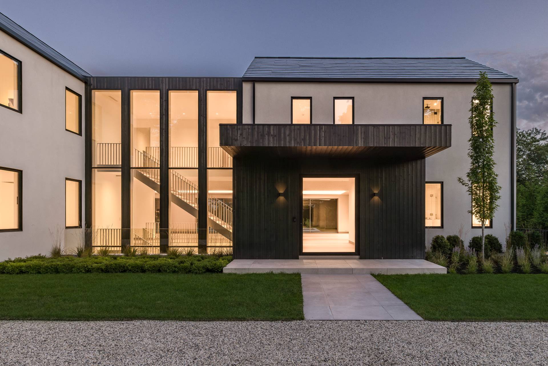 10 Mill Path Bridgehampton, NY 11963 - Photo 45 of 46 a front view of a house with a yard