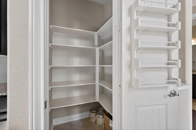 a view of staircase with white walls