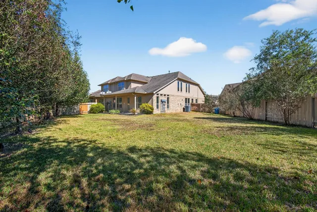 a front view of a house with a yard and a garage