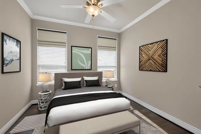 a bedroom with a bed and a painting on the wall