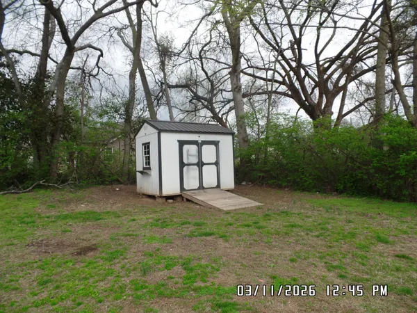 a kitchen with a refrigerator and a stove