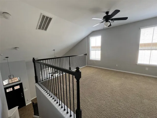 a view of empty room with windows