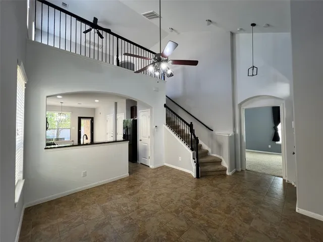 a view of entryway and hall with a chandelier