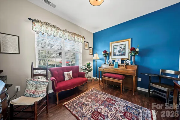 a living room with furniture and a rug