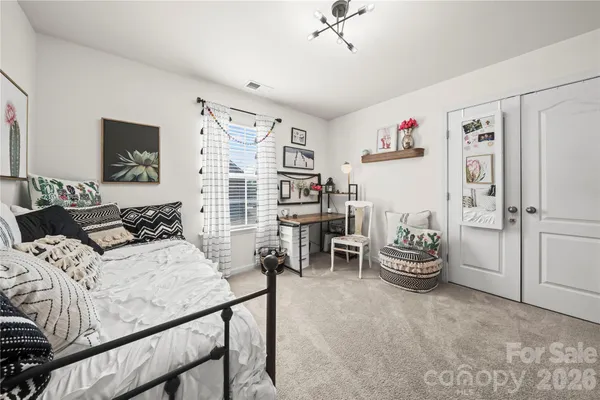 a bedroom with furniture and a table