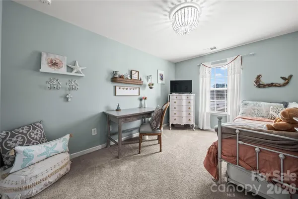 a living room with furniture a dining table and a piano table