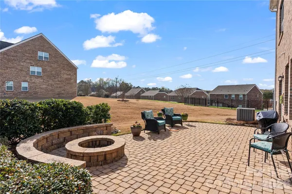 a view of swimming pool with outdoor seating and plants