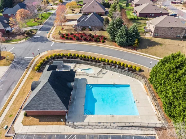 a view of swimming pool with a outdoor seating