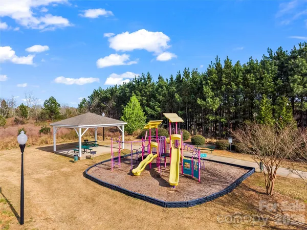 a view of a swimming pool with an outdoor seating