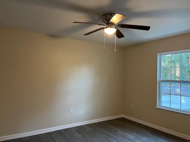 4366 Southeast 138th Street Summerfield, FL 34491 - Photo 12 of 23 an empty room with a window and ceiling fan