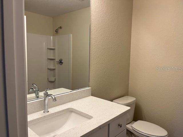 4366 Southeast 138th Street Summerfield, FL 34491 - Photo 14 of 23 a bathroom with a sink a toilet and shower