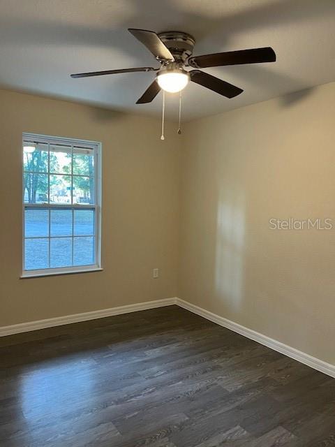 4366 Southeast 138th Street Summerfield, FL 34491 - Photo 17 of 23 an empty room with wooden floor and windows