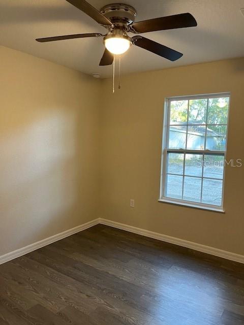 4366 Southeast 138th Street Summerfield, FL 34491 - Photo 18 of 23 a view of an empty room with wooden floor and a window