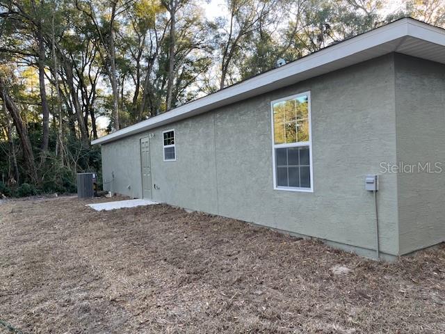 4366 Southeast 138th Street Summerfield, FL 34491 - Photo 20 of 23 a backyard of a house with lots of green space