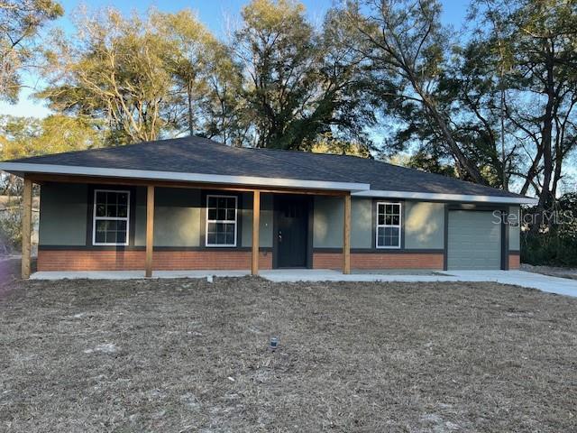 4366 Southeast 138th Street Summerfield, FL 34491 - Photo 2 of 23 front view of house with a yard