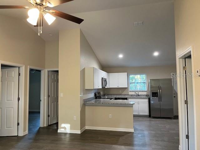 4366 Southeast 138th Street Summerfield, FL 34491 - Photo 3 of 23 a kitchen with a refrigerator and a sink