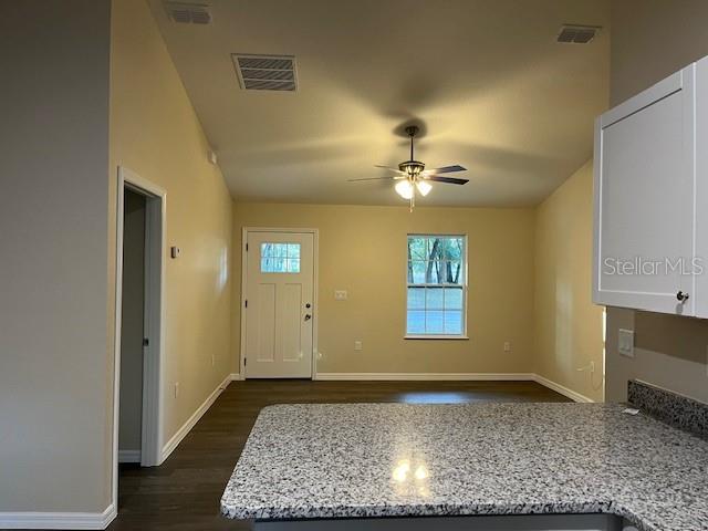 4366 Southeast 138th Street Summerfield, FL 34491 - Photo 6 of 23 a view of a livingroom with a rug wooden floor and a window