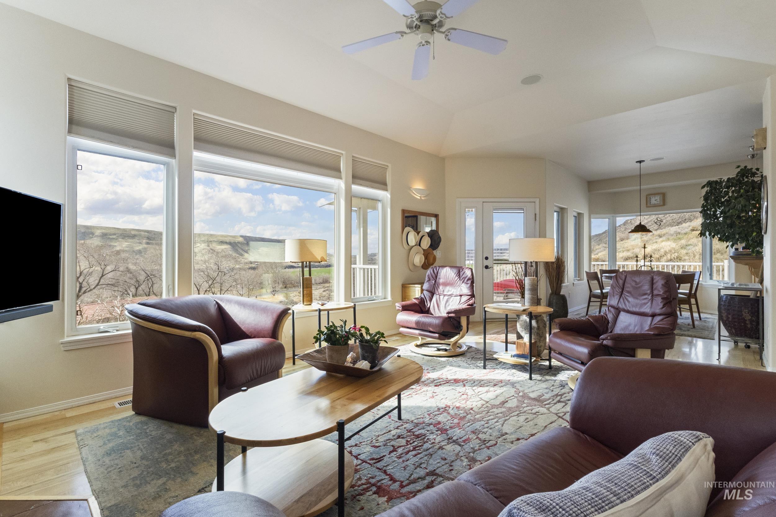 382 River Road Bliss, ID 83314 - Photo 13 of 46 Living room featuring ceiling fan and wood finished floors
