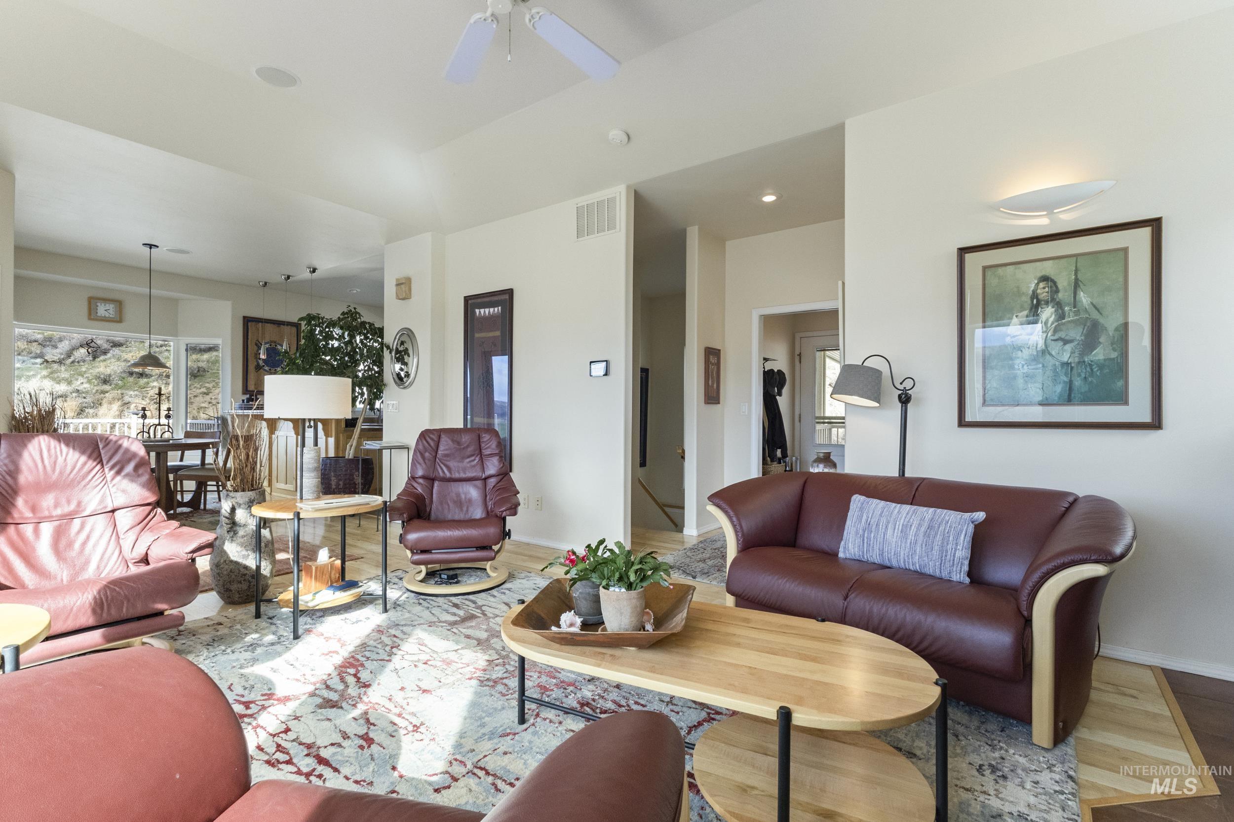 382 River Road Bliss, ID 83314 - Photo 14 of 46 Living area featuring wood finished floors and ceiling fan