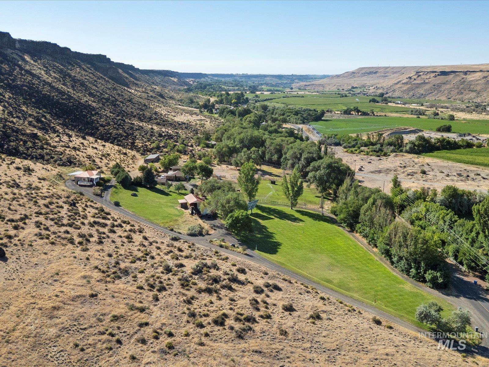 382 River Road Bliss, ID 83314 - Photo 3 of 46 Aerial view of sparsely populated area featuring a mountain backdrop