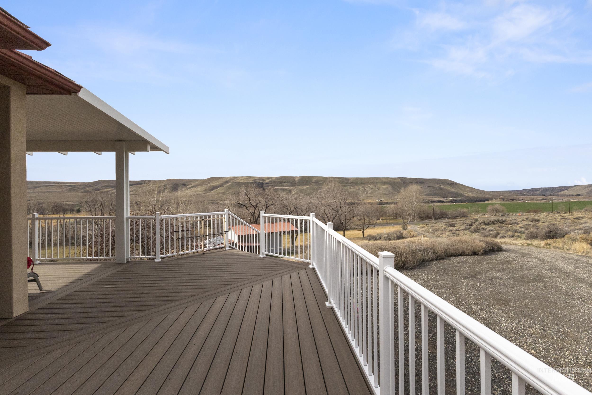 382 River Road Bliss, ID 83314 - Photo 34 of 46 Wooden deck featuring a mountain view and a view of rural / pastoral area