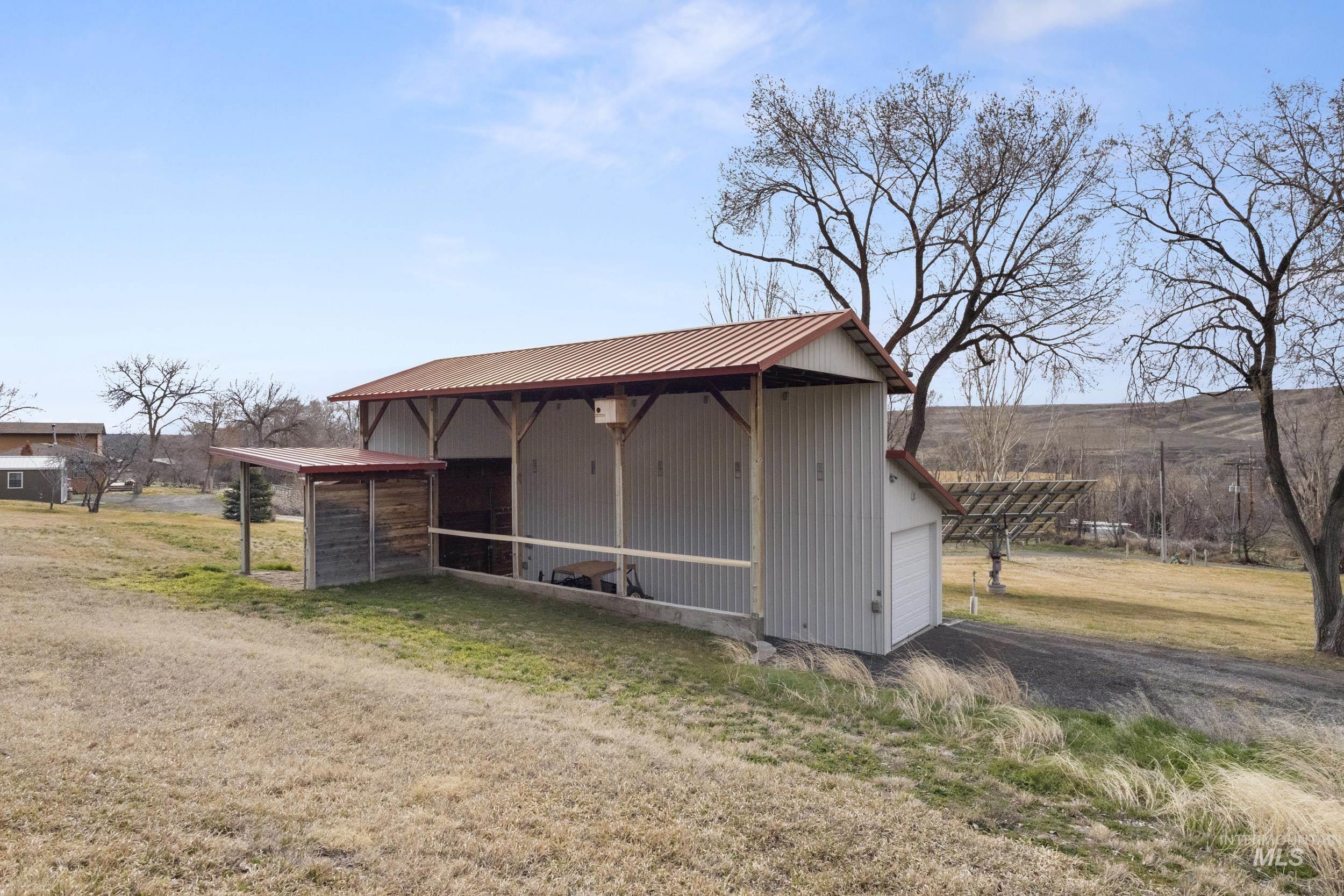 382 River Road Bliss, ID 83314 - Photo 38 of 46 View of outbuilding with a rural view and dirt driveway