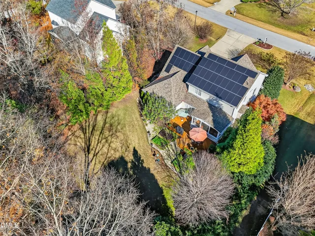 an aerial view of residential house with outdoor space and swimming pool
