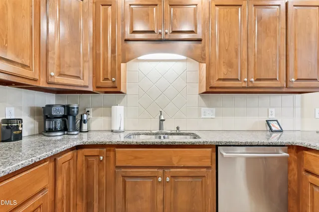 a bathroom with a tub a sink and a window