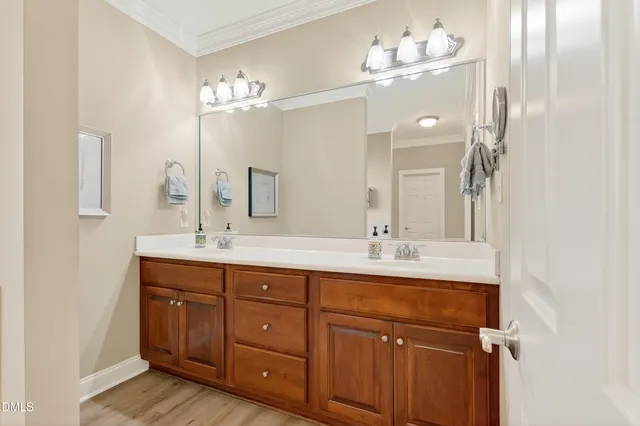 an empty room with a window and a ceiling fan