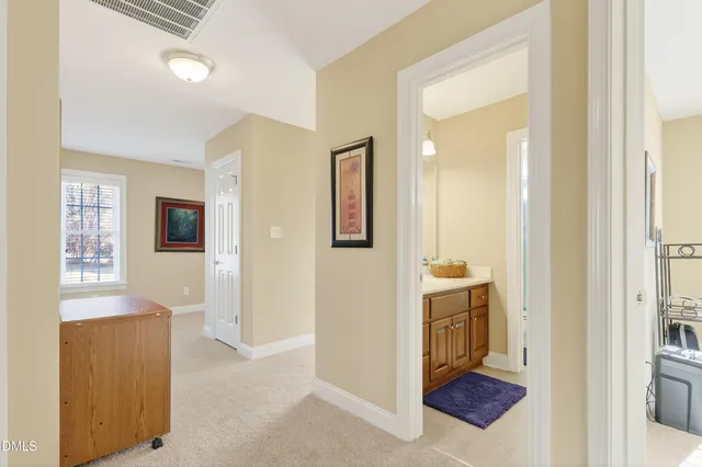 a view of a pathway with a garden