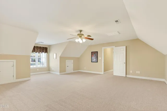 an aerial view of a swimming pool with outdoor seating